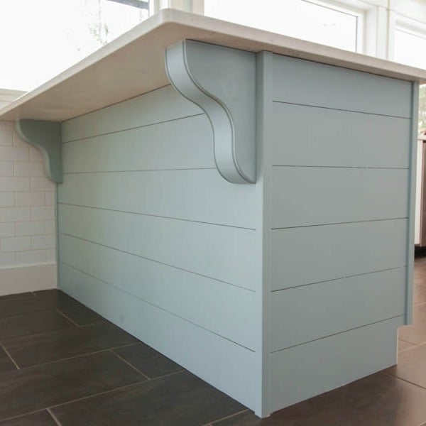 DIY planked peninsula with corbels