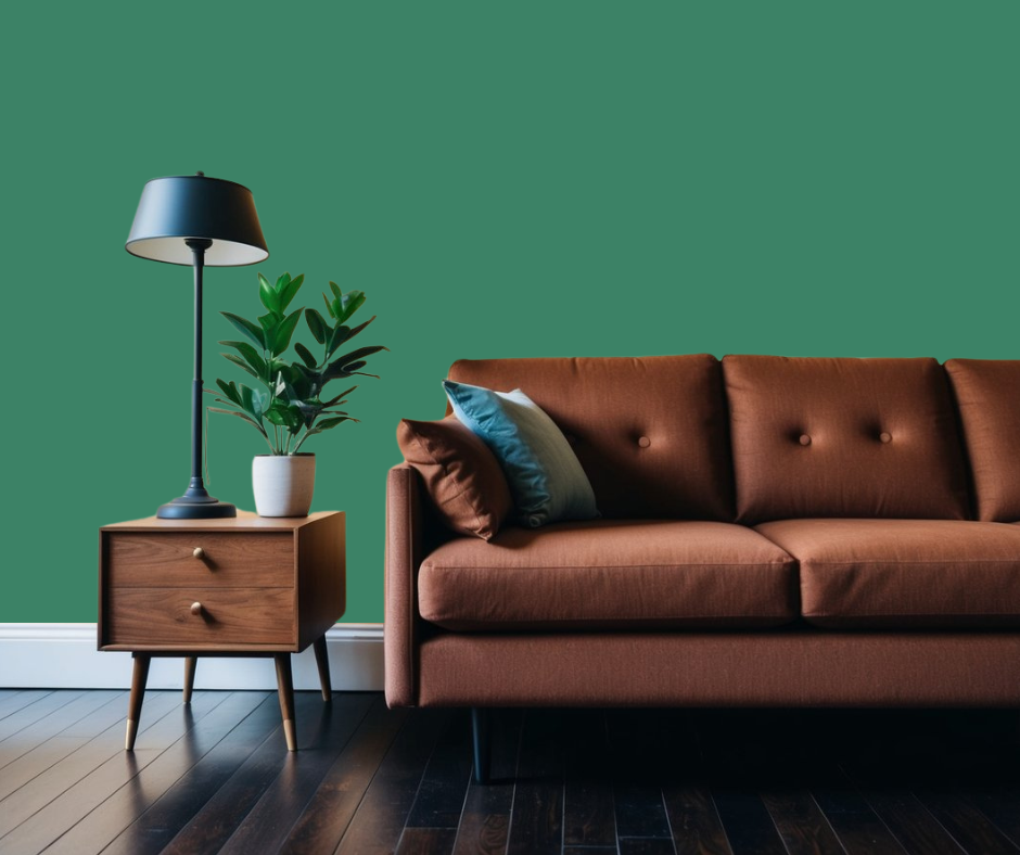 Verdigris green wall paint color in room with brown furniture.