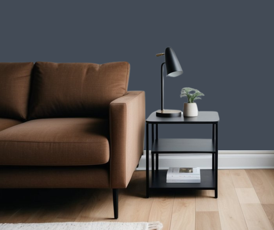 Hale navy wall paint color in room with brown furniture.