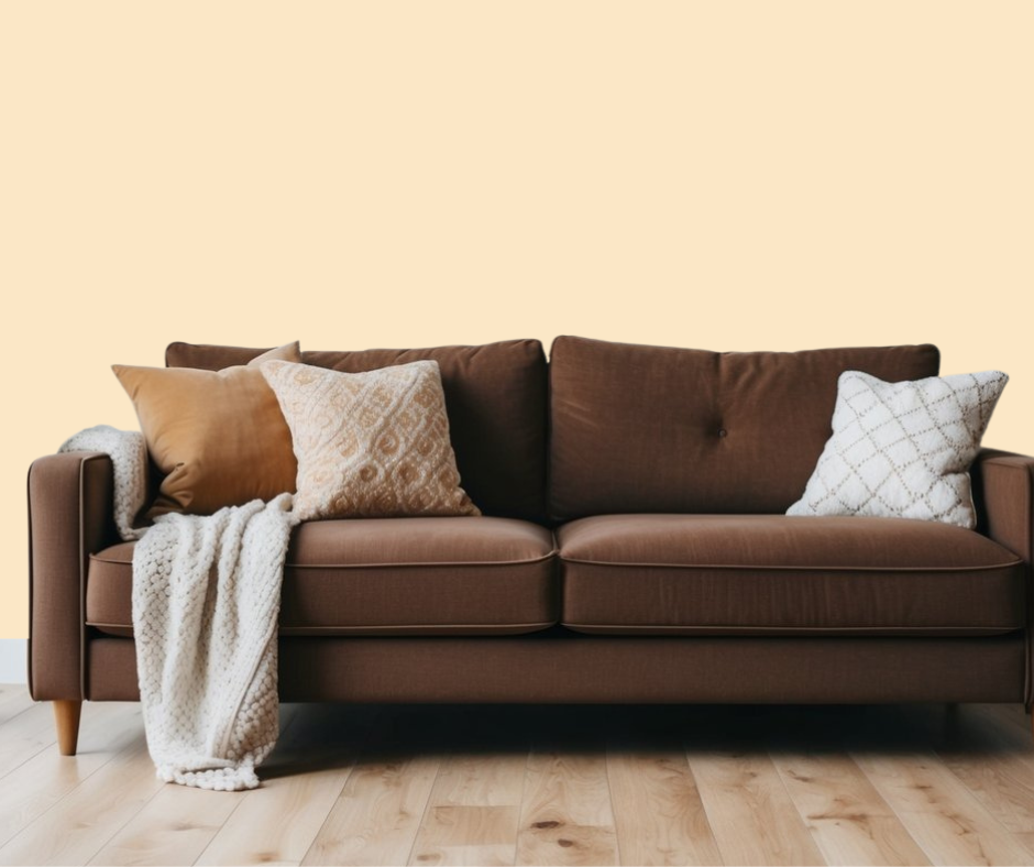 Soft beige wall paint color in room with dark brown furniture