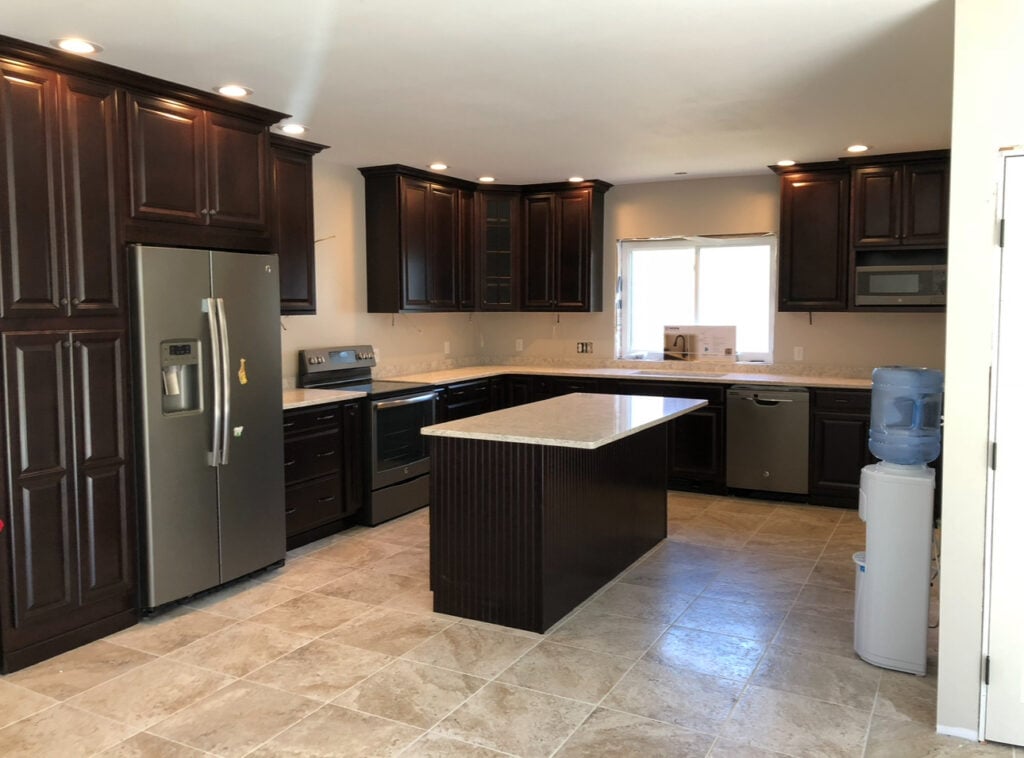 Kitchen with Edgecomb gray walls and dark wood cabinets.