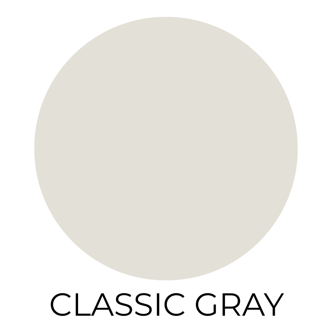 Solid paint swatch labeled “Classic Gray.” The color is a soft, warm greige—very light with subtle beige undertones, offering a barely-there neutral appearance. The text is centered below the swatch in bold black letters.