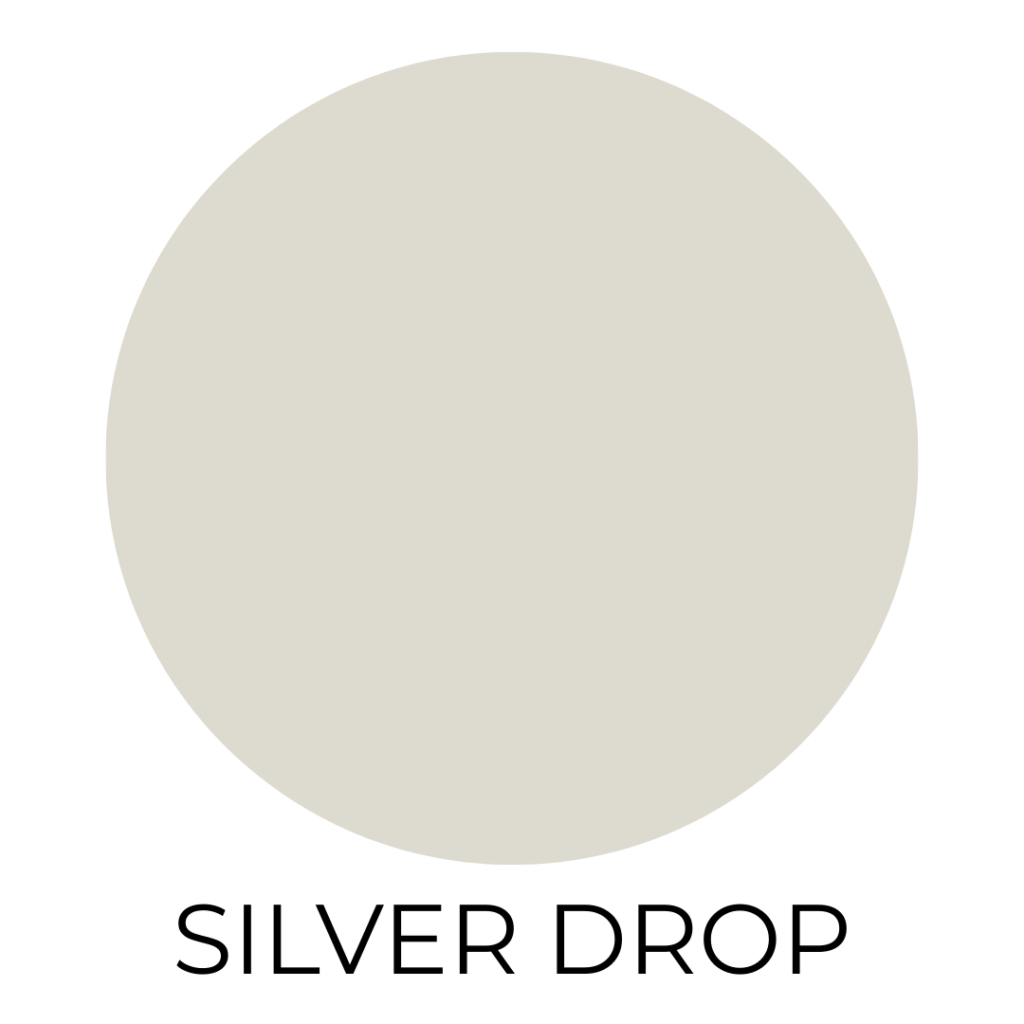 A solid color swatch labeled "Silver Drop" displays a soft, pale greige hue with cool undertones. The large circular sample sits centered on a white background with the color name written in clean black text beneath it.