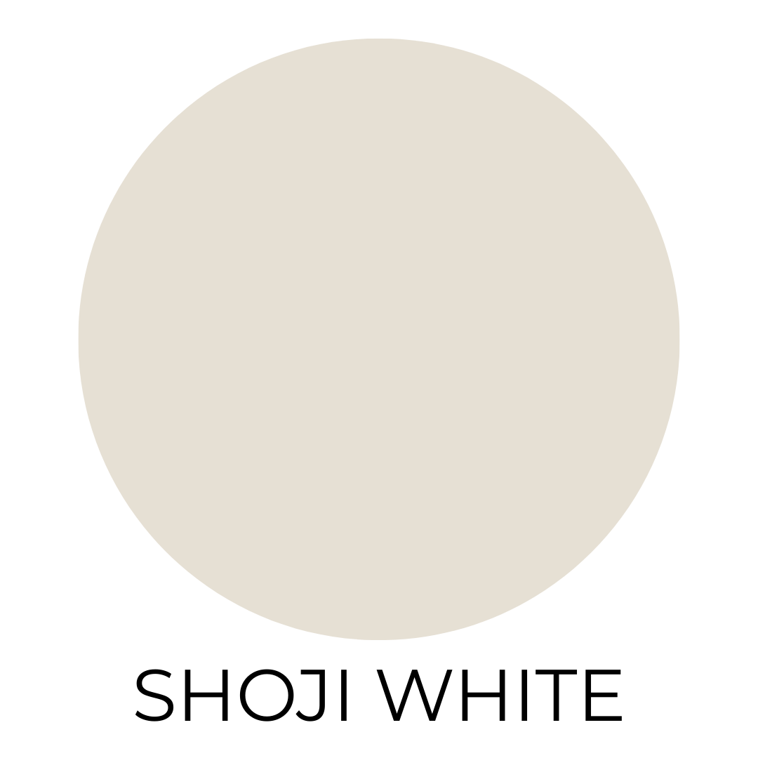 A digital paint swatch labeled “Shoji White.” The swatch features a soft, creamy off-white with subtle beige undertones, offering a warm and welcoming neutral. The paint color is shown as a centered circle on a clean white background with the name “SHOJI WHITE” displayed below in bold black capital letters.