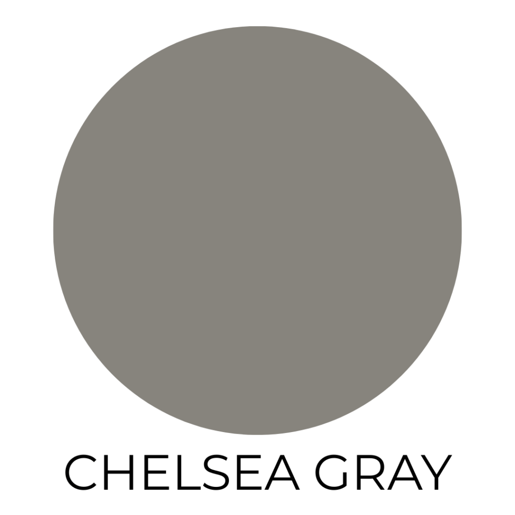 A digital paint swatch labeled “Chelsea Gray” by Benjamin Moore. The swatch features a large, solid circle filled with a medium-to-dark warm gray hue that has subtle brown undertones. The background is white, and the name “CHELSEA GRAY” is centered below the circle in bold, black, all-caps sans-serif font.