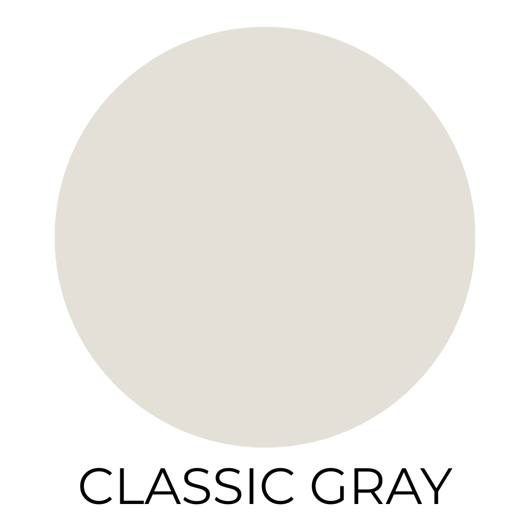 Round swatch of Benjamin Moore Classic Gray paint, a warm light gray with creamy tones, shown against a white background.