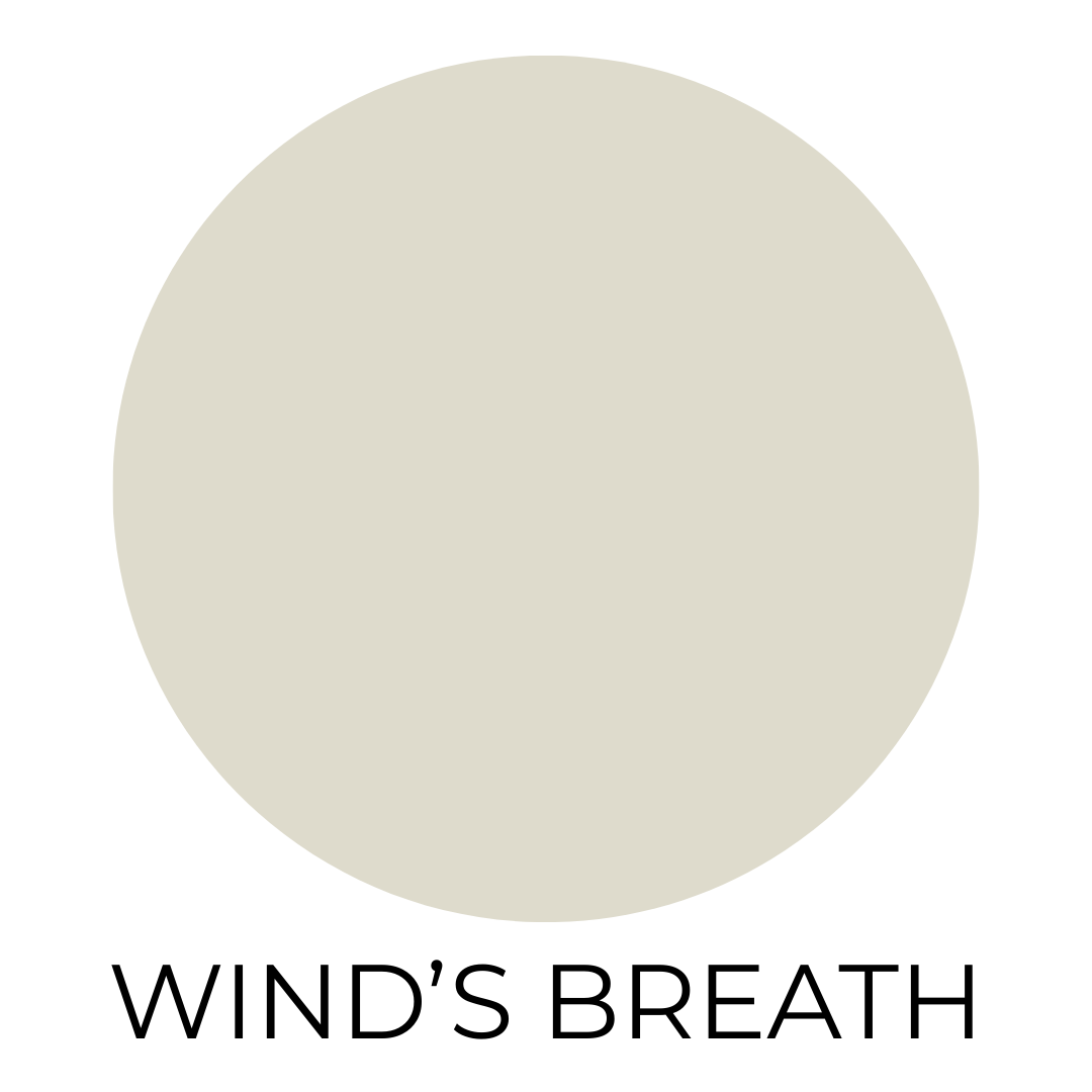 A muted pale greige paint swatch labeled ‘Wind’s Breath’ shown on a simple white background.