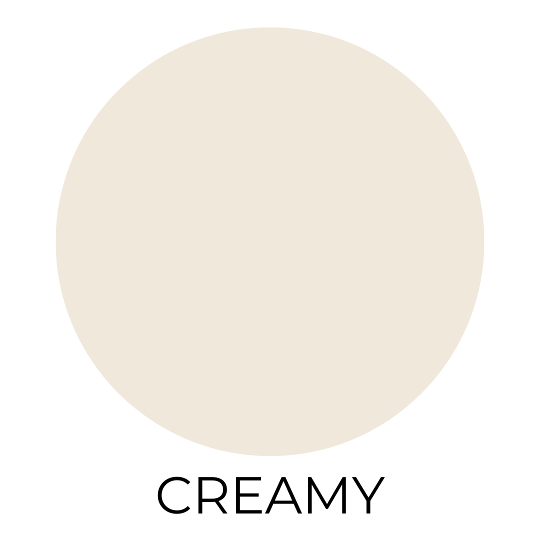 A soft creamy beige paint swatch labeled ‘Creamy’ shown on a crisp white background.