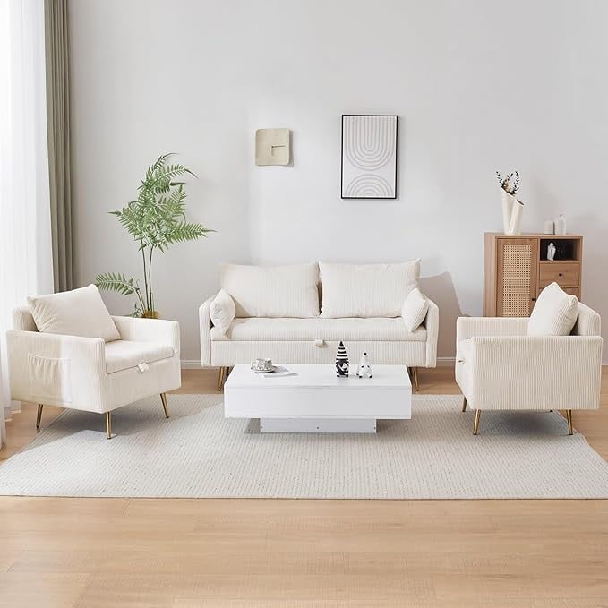 Modern minimalist living room with exposed-leg furniture, including a cream-colored sofa and matching armchairs, set on a light area rug. Neutral tones, natural light, and clean lines make the space feel bright and open ideal for small room design.