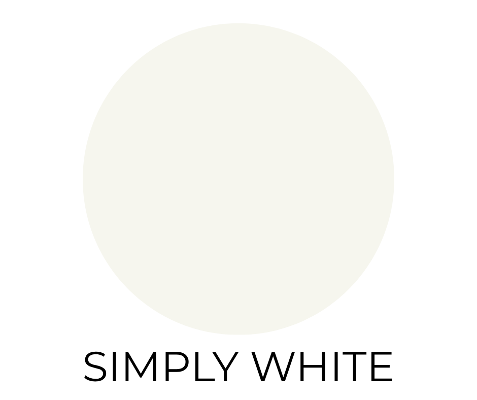 Benjamin Moore Simply White paint swatch. A bright, warm white circle on a white background with the words “SIMPLY WHITE” in bold, black letters below.
