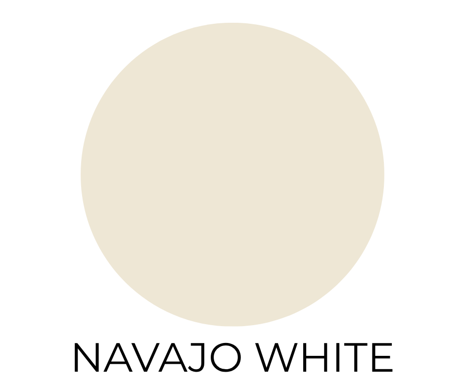 Benjamin Moore Navajo White paint swatch. A creamy, warm white circle with subtle beige undertones on a white background. The words “NAVAJO WHITE” appear in bold, black letters below.