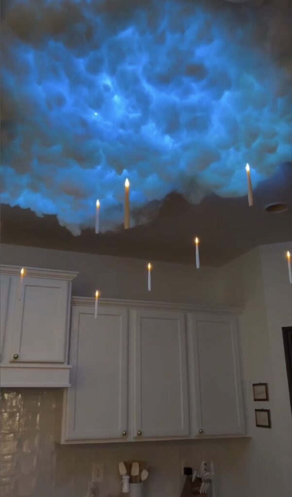 DIY Halloween decor floating candles from ceiling nd light up clouds.