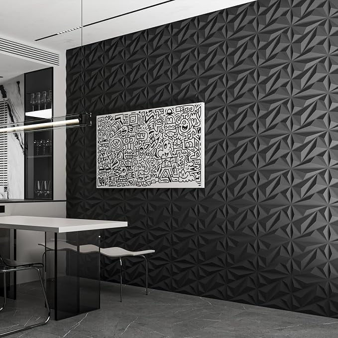 Black 3D geometric wall panels creating a dramatic textured accent wall in a modern dining room with black and white decor.