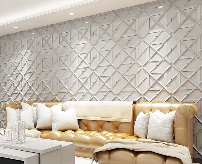 Light gray geometric decorative wall panels creating a textured accent wall behind a tan leather sofa in a modern living room.