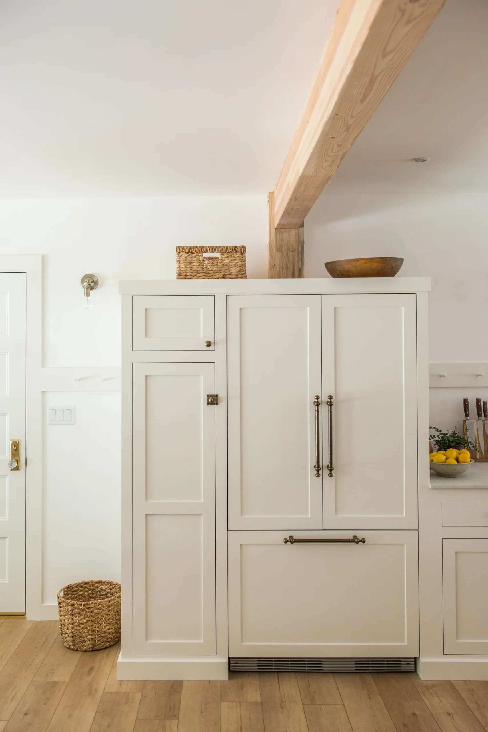 Kitchen cabinets painted in Benjamin Moore Swiss Coffee.